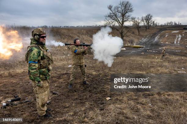 Member of the Ukrainian Volunteer Army fires a rocket propelled grenade while testing weapons systems on February 25, 2023 in the Donbas region of...