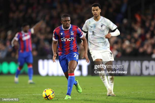 Cheick Doucoure of Crystal Palace looks to pass the ball whilst under pressure from Cody Gakpo of Liverpool during the Premier League match between...