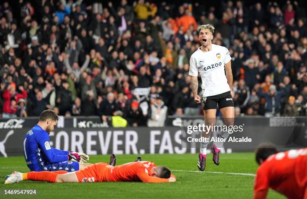 Hugo Duro of Valencia CF celebrates after Igor Zubeldia of Real Sociedad concedes an own goal, the first goal for Valencia CF, during the LaLiga...