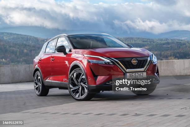 nissan qashqai e-power on a parking - nissan stock pictures, royalty-free photos & images