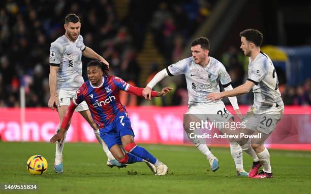 Andy Robertson of Liverpool and Diogo Jota of Liverpool with Crystal Palace's Michael Olise during the Premier League match between Crystal Palace...