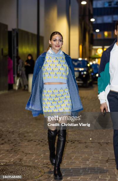 Olivia Palermo wears oversized denim jacket, skirt and cropped jumper with print, black over knees pants outside Des Phemmes during the Milan Fashion...