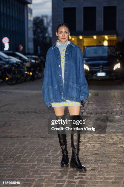 Olivia Palermo wears oversized denim jacket, skirt and cropped jumper with print, black over knees pants outside Des Phemmes during the Milan Fashion...