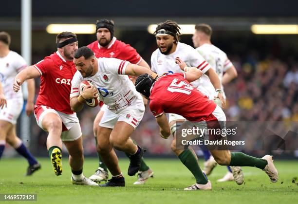 Ellis Genge of England goes past Leigh Halfpenny during the Six Nations Rugby match between Wales and England at the Principality Stadium on February...