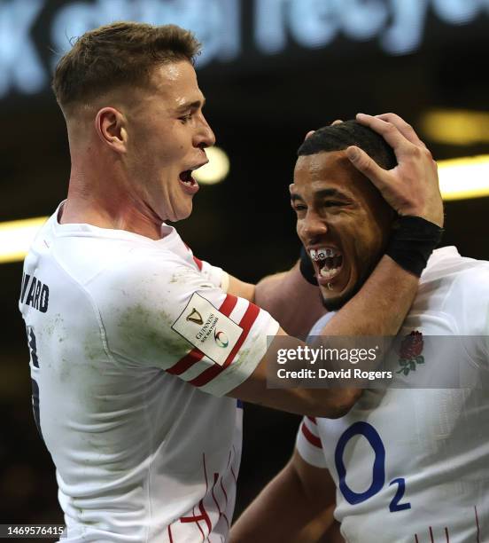 Anthony Watson of England celebrates with team mate Freddie Steward after scoring their first try during the Six Nations Rugby match between Wales...