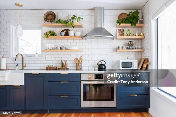 interior of home kitchen - kitchen cupboard stockfoto's en -beelden