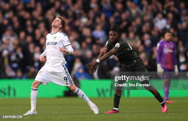 Leeds player Patrick Bamford is pushed off the field by Southampton player Romeo Lavia after Bamford took his time leaving the field after being...