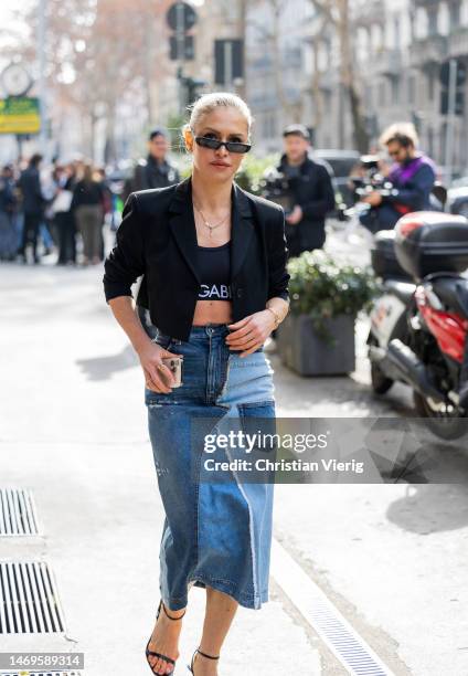 Maja Malnar wears denim skirt outside Dolce & Gabbana during the Milan Fashion Week Womenswear Fall/Winter 2023/2024 on February 25, 2023 in Milan,...