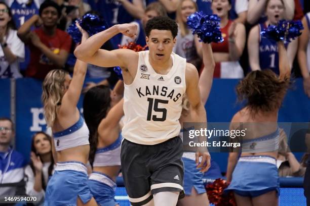 Kevin McCullar Jr. #15 of the Kansas Jayhawks celebrates a basket against the West Virginia Mountaineers in the second half at Allen Fieldhouse on...