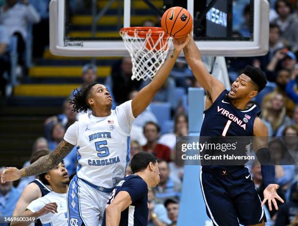 Armando Bacot of the North Carolina Tar Heels battles Jayden Gardner of the Virginia Cavaliers for a rebound during the first half of their game at...