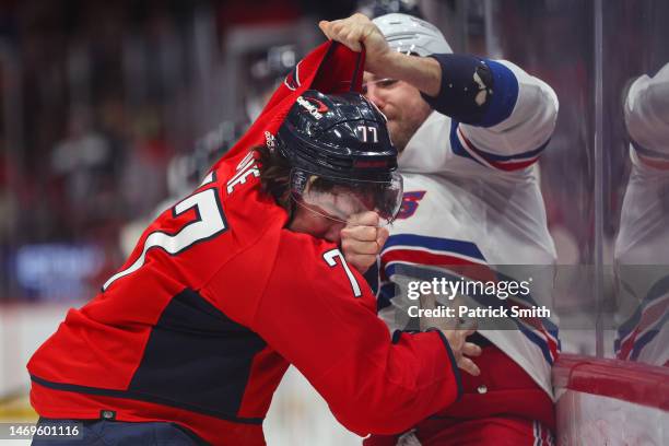 Oshie of the Washington Capitals is punched in the face by Barclay Goodrow of the New York Rangers as the fight during the first period at Capital...