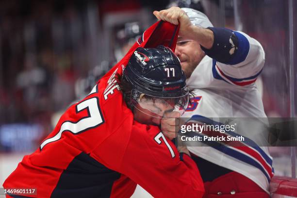 Oshie of the Washington Capitals is punched in the face by Barclay Goodrow of the New York Rangers as the fight during the first period at Capital...