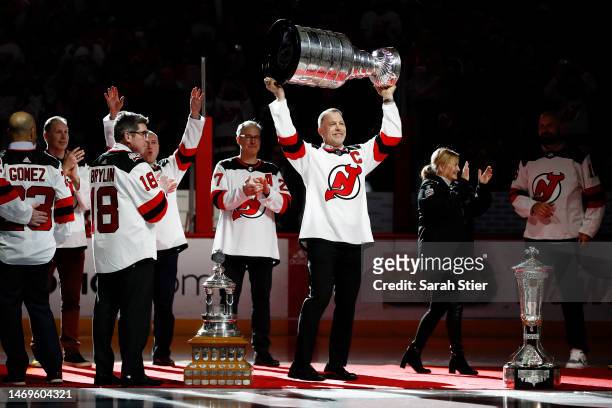 Former New Jersey Devil Scott Stevens raises the Stanley Cup during the 2003 Championship 20th Anniversary Celebration Presented by Citizens before...