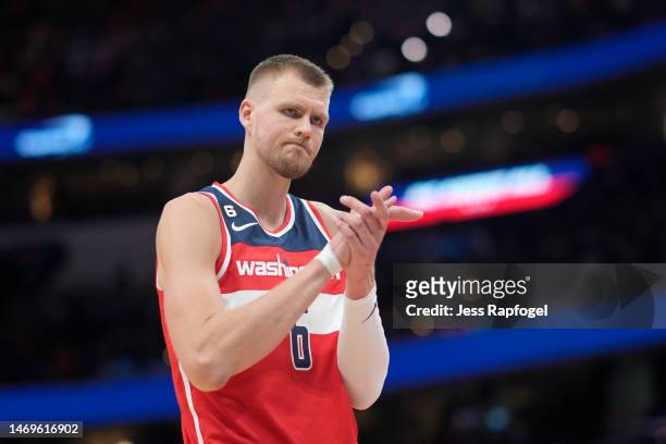 Kristaps Porzingis of the Washington Wizards claps as fans cheer him on during the game against the New York Knicks at Capital One Arena on February...
