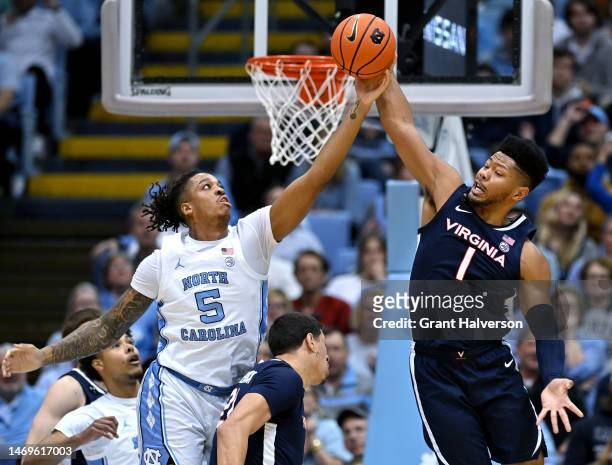 Armando Bacot of the North Carolina Tar Heels battles Jayden Gardner of the Virginia Cavaliers for a rebound during the first half of their game at...