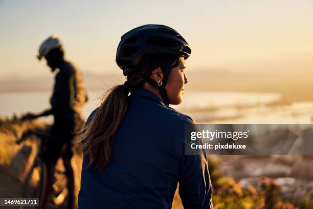 fitness, back and woman with bike, helmet and outdoor for training for competition, healthy lifestyle and view. exercise, female athlete and biker for practice, wellness or biker on the road to relax - asian championship bildbanksfoton och bilder