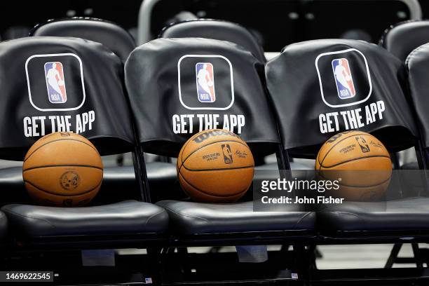 Wilson basketballs sit on the Miami Heat bench before the game between the Milwaukee Bucks and Miami Heat at Fiserv Forum on February 24, 2023 in...