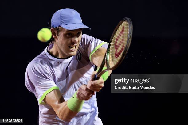 Nicolás Jarry of Chile returns a shot to Carlos Alcaraz of Spain during day six of ATP 500 Rio Open presented by Claro at Jockey Club Brasileiro on...