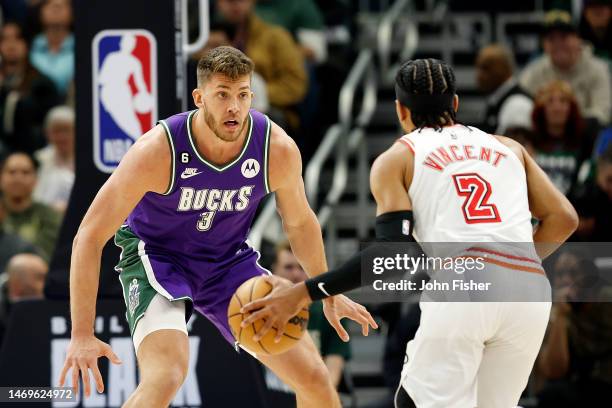 Meyers Leonard of the Milwaukee Bucks plays defense on Gabe Vincent of the Miami Heat during the first half of the game at Fiserv Forum on February...