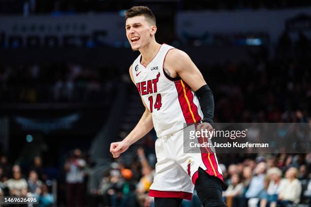 Tyler Herro of the Miami Heat reacts in the fourth quarter during their game against the Charlotte Hornets at Spectrum Center on February 25, 2023 in...