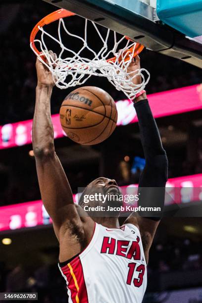 Bam Adebayo of the Miami Heat dunks the ball in the third quarter during their game against the Charlotte Hornets at Spectrum Center on February 25,...