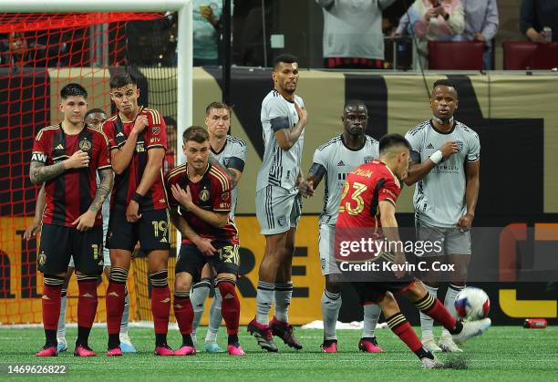 Thiago Almada of Atlanta United scores the go-ahead goal on a free kick in stoppage time against the San Jose Earthquakes at Mercedes-Benz Stadium on...