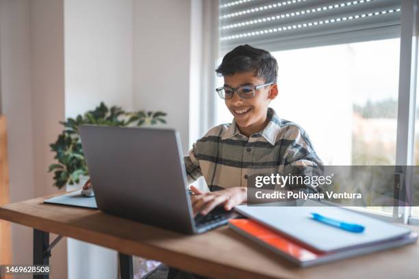 boy studying online at home - bright future stock pictures, royalty-free photos & images