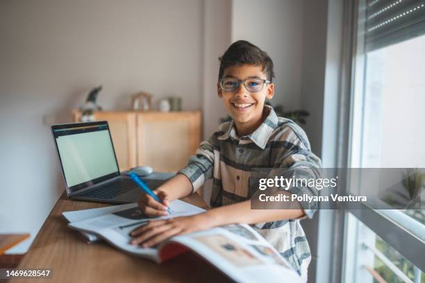 boy studying online at home - bright future stock pictures, royalty-free photos & images