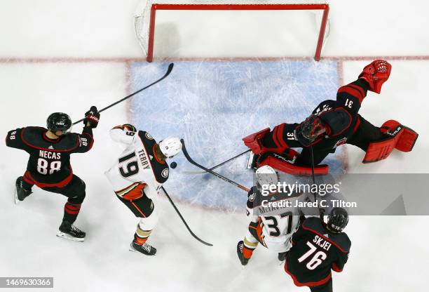 Frederik Andersen of the Carolina Hurricanes makes a stick save during the first period of the game against the Anaheim Ducks at PNC Arena on...