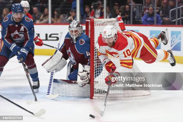 Jonathan Huberdeau of the Calgary Flames sails over the goal looking for an opening against the Colorado Avalanche in the first period at Ball Arena...