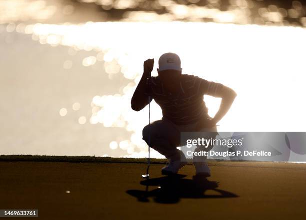 Justin Suh of the United States lines up a putt on the 17th hole during the third round of The Honda Classic at PGA National Resort And Spa on...