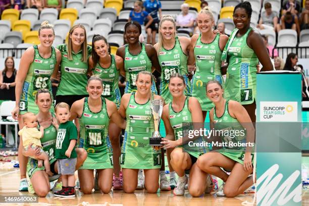 Players of the Fever celebrate with the trophy after winning the 2023 Team Girls Cup final match between West Coast Fever and Adelaide Thunderbirds...