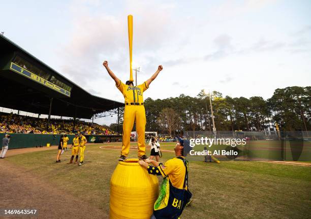 Matt Malatesta balances a bat on his chin between innings during their home opener against the Party Animals at Grayson Stadium on February 25, 2023...