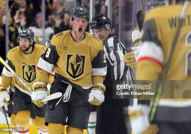 Jack Eichel of the Vegas Golden Knights celebrates with teammates on the bench after scoring a third-period goal against the Dallas Stars during...