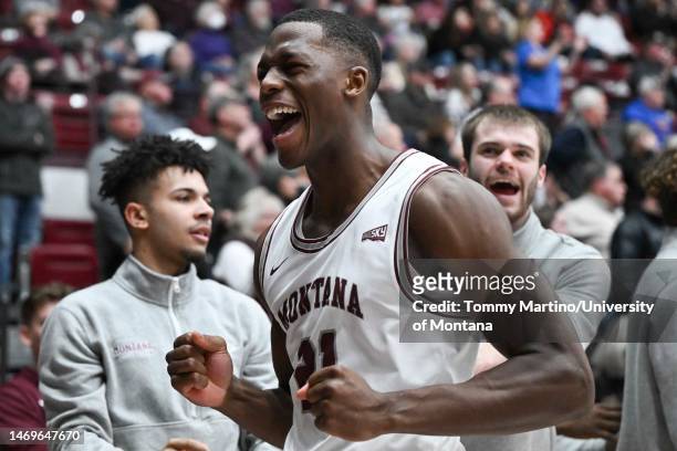 Laolu Oke of the Montana Grizzlies celebrates in the second half of a game against the Sacramento State Hornets at Dahlberg Arena on February 25,...