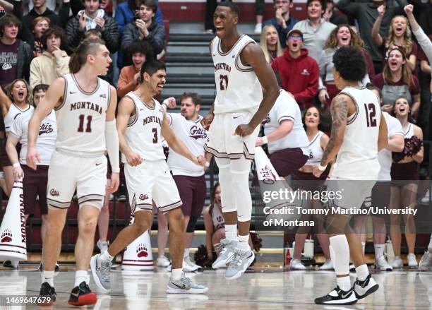 Laolu Oke of the Montana Grizzlies celebrates in the second half of a game against the Sacramento State Hornets at Dahlberg Arena on February 25,...