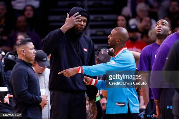 Chris Paul gestures at Kevin Durant of the Phoenix Suns during the game against the Oklahoma City Thunder at Footprint Center on February 24, 2023 in...
