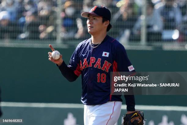 Pitcher Yoshinobu Yamamoto of Samurai Japan reacts in the third inning during the practice game between Samurai Japan and Fukuoka SoftBank Hawks at...