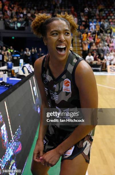 Tianna Hawkins of the Fire celebrates after winning the round 15 WNBL match between Townsville Fire and Sydney Flames at Townsville Entertainment...