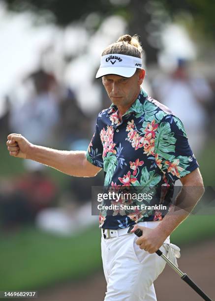 Marcel Siem of Germany celebrates after putting on the 15th green during Day Four of the Hero Indian Open at Dlf Golf and Country Club on February...