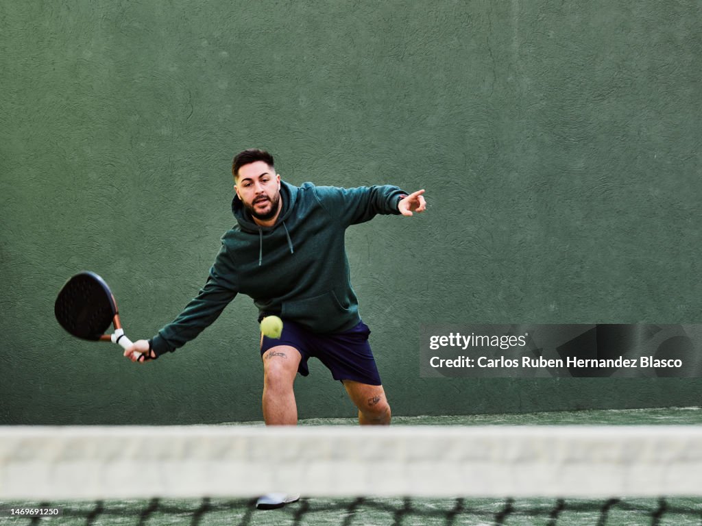 Man playing paddle tennis
