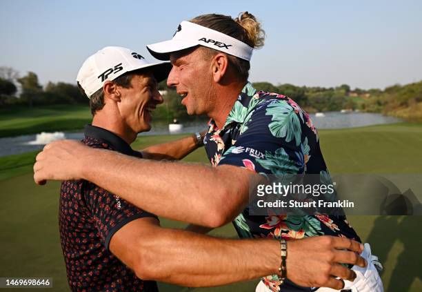 Marcel Siem of Germany is congratulated by Thorbjorn Olesen of Denmark after winning the Hero Indian Open at Dlf Golf and Country Club on February...
