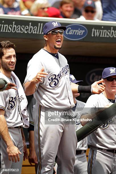 Carlos Gomez of the Milwaukee Brewers smiles as he celebrates a home run by a teammate against the Minnesota Twins on June 16, 2012 at Target Field...