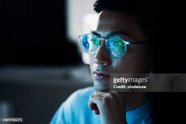 code,  asian man  and reflection in glasses, focus and programming for cyber security, hacking and modern office. japan, male employee with eyewear and it specialist coding, programming and thinking - test stockfoto's en -beelden