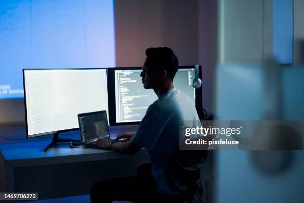 web design, coding and asian man with a computer for programming a website at night. cyber security, developer and programmer reading information for a software database on a pc in a dark office - it security imagens e fotografias de stock