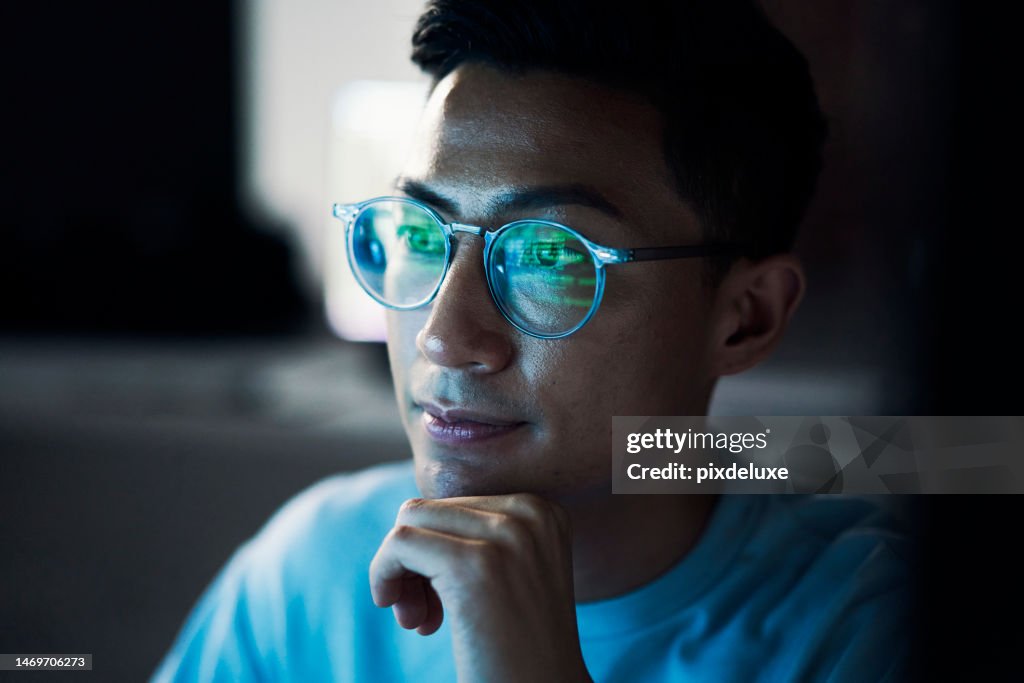 Asian man, developer and thinking in coding at night or programming software or application development. Male programmer or coder troubleshooting and working late on code in problem solving at office