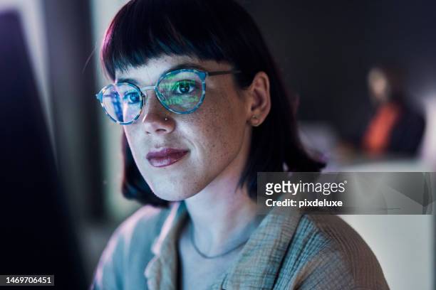 business woman face, computer and ux coding of young employee with blue light and glasses. digital code, hacker ai and reading of a female worker at night planning with online cybersecurity data - hacker computer stockfoto's en -beelden