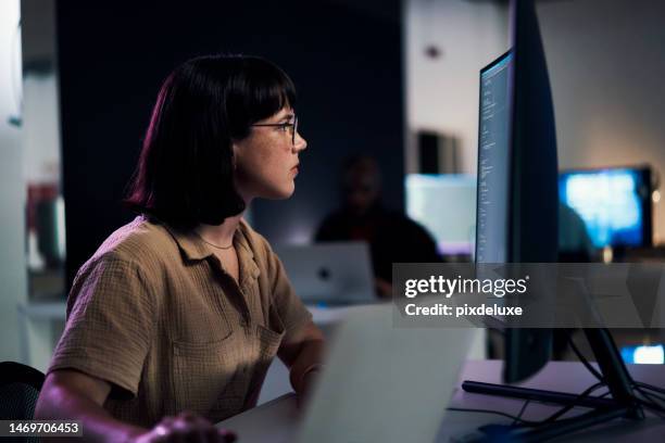 serious, computer screen and night with woman and coding for software engineering, developer or designer. cyber security, data science and code with employee in office for neon, website or technology - low code stock pictures, royalty-free photos & images