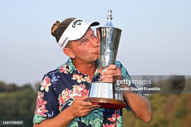 Marcel Siem of Germany kisses the Hero Indian Open trophy after winning the Hero Indian Open at Dlf Golf and Country Club on February 26, 2023 in...