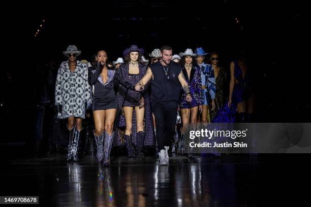 Designer Philipp Plein walks the runway with models during finale at the Philipp Plein fashion show during the Milan Fashion Week Womenswear...